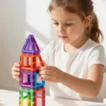 Little girl building magnet figures